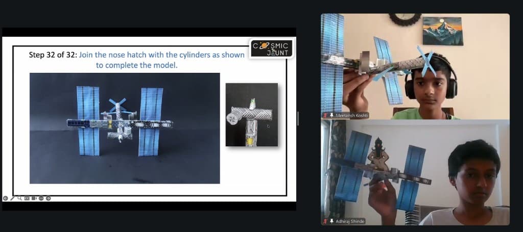 An online session with a space-station build guide and children holding their models