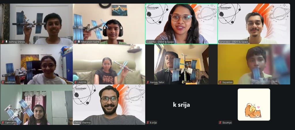 A laptop showing a live workshop with a facilitator and children